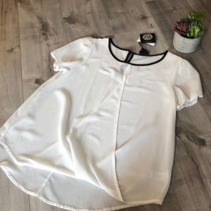 Ivory blouse with black trim